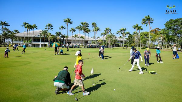 Lotus Valley Golf Resort 10 people people standing people playing sports and grass