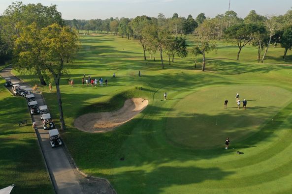 Lam Luk Ka Country Club 7 people golf course and grass