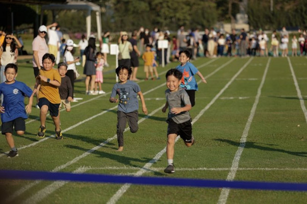 The Royal Bangkok Sports Club 8 people child people standing people playing sports and grass