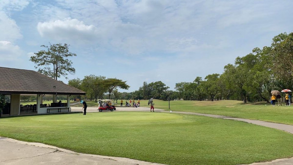 The Pine Golf Club 5 people golf course and grass