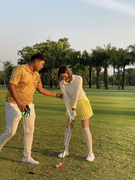 Pinehurst Golf Club amp Hotel 2 people people golfing people standing and grass
