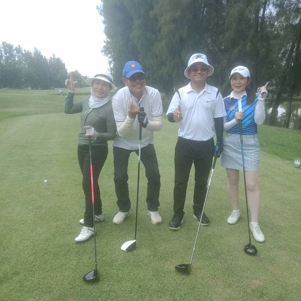 The Pine Golf Club 4 people people golfing and golf course