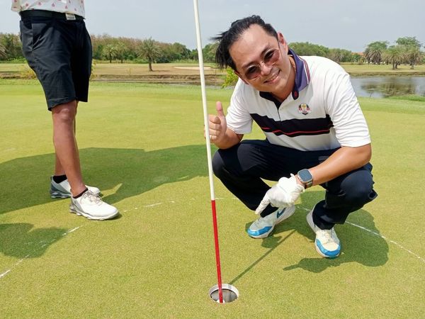 Bangpakong Riverside Country Club 2 people people golfing and golf course