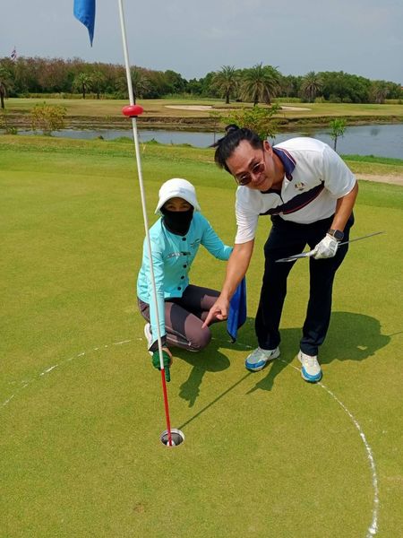 Bangpakong Riverside Country Club 2 people people golfing golf course and text