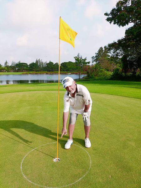 The Vintage Club 1 person golfing golf course and text