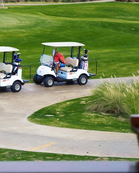 Siam Country Club Bangkok 3 people people golfing golf cart golf course and text