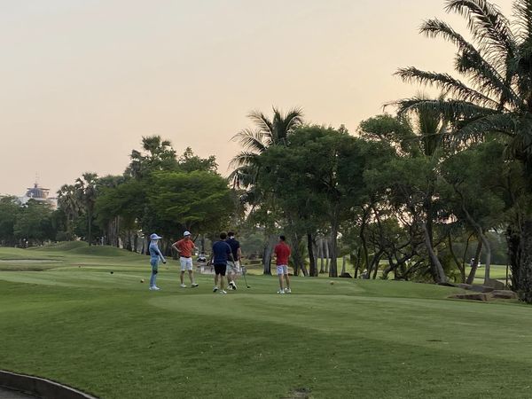 Summit Windmill Golf Club amp Residence 5 people people golfing golf course and twilight