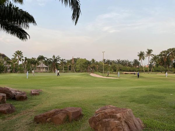 Summit Windmill Golf Club amp Residence 5 people people golfing grass golf course and twilight