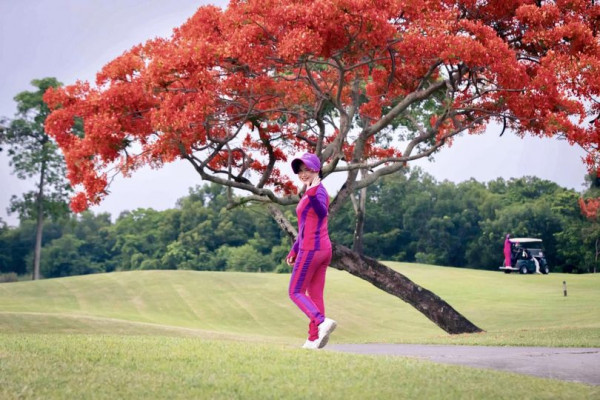 Lotus Valley Golf Resort 2 people people golfing jacaranda and golf course