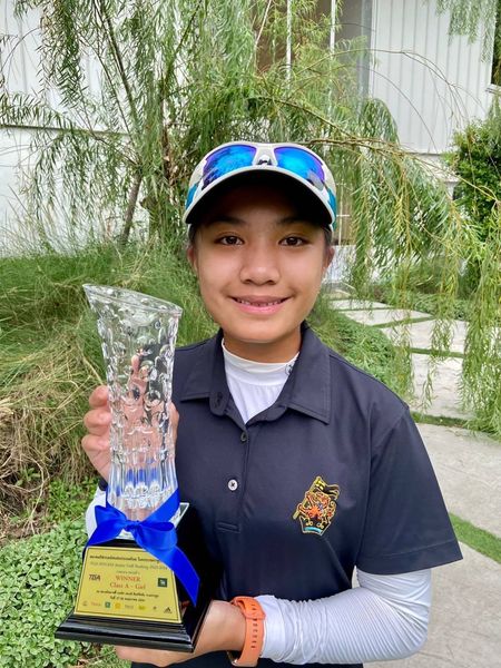 Krungthep Kreetha 1 person golfing playing tennis and text