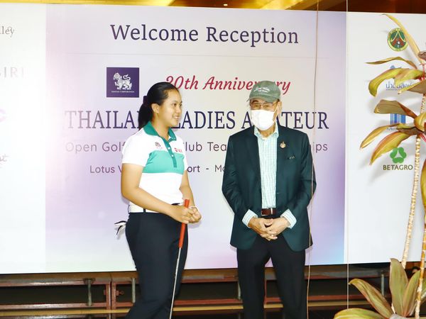 Lotus Valley Golf Resort 2 people dais and text