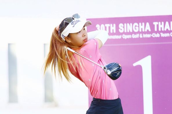 Lotus Valley Golf Resort 1 person golfing golf course and text