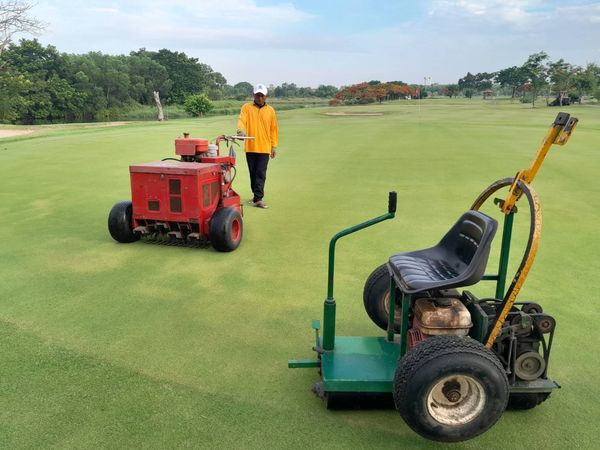 Bangpakong Riverside Country Club 1 person golfing golf cart grass and golf course