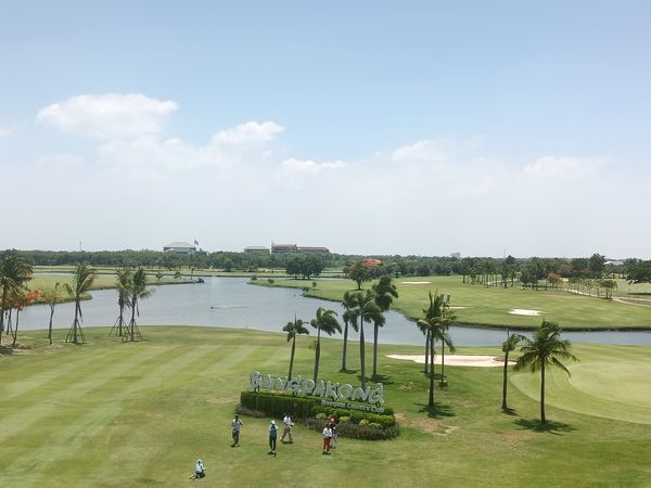 Bangpakong Riverside Country Club 4 people people golfing golf cart and golf course