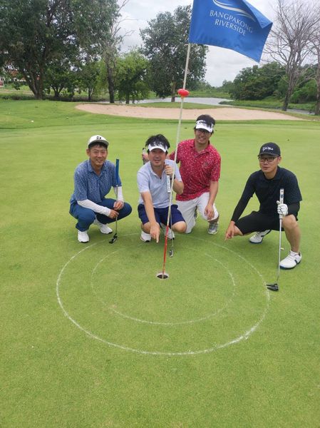 Bangpakong Riverside Country Club 4 people people golfing golf course and text