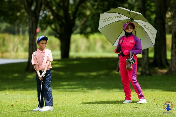 Lotus Valley Golf Resort 2 people child people golfing golf course and text