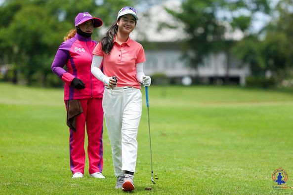 Lotus Valley Golf Resort 2 people people golfing golf course and text