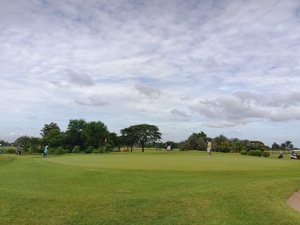 Bangpakong Riverside Country Club 4 people people golfing and golf course