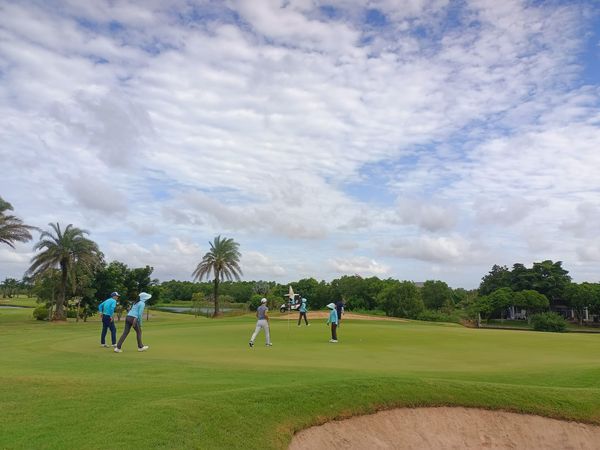 Bangpakong Riverside Country Club 5 people people golfing golf cart and golf course