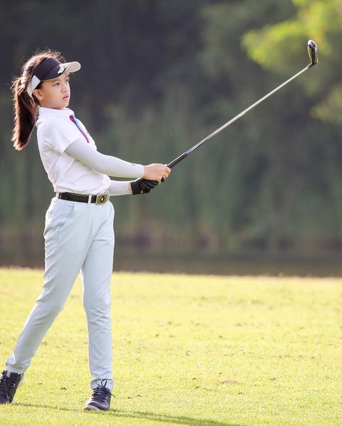 Lotus Valley Golf Resort 1 person golfing and golf course