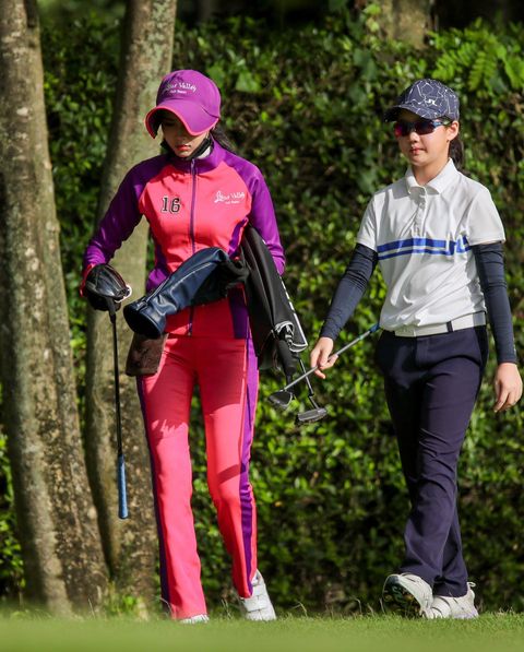 Lotus Valley Golf Resort 2 people people golfing golf course and text-4