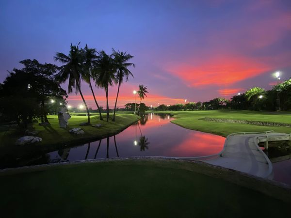 Summit Windmill Golf Club amp Residence 1 person golfing horizon twilight golf course and nature