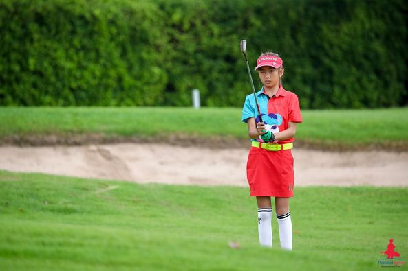 Lotus Valley Golf Resort 1 person golfing golf course and text