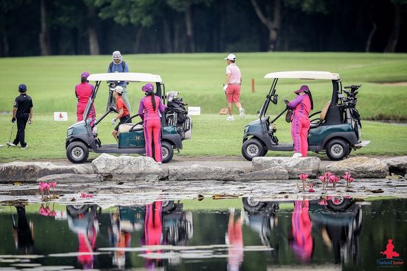 Lotus Valley Golf Resort 7 people people golfing golf cart golf course and text