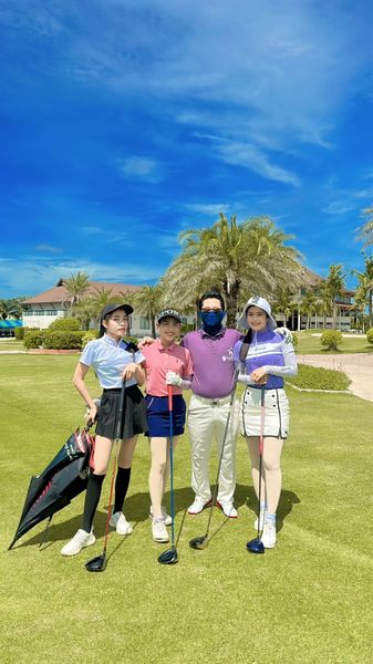 Bangpakong Riverside Country Club 4 people people golfing golf cart and golf course
