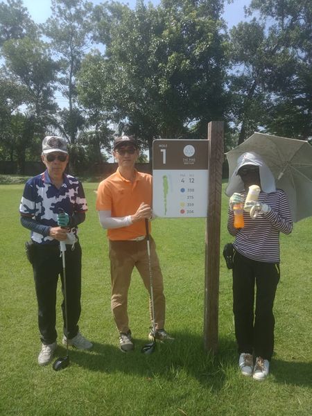 The Pine Golf Club 3 people people golfing golf course and text