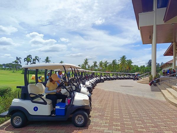 Bangpakong Riverside Country Club 2 people people golfing golf cart and golf course