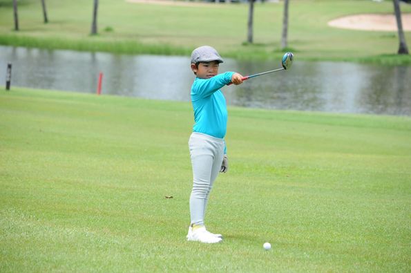Lotus Valley Golf Resort 1 person golfing and golf course