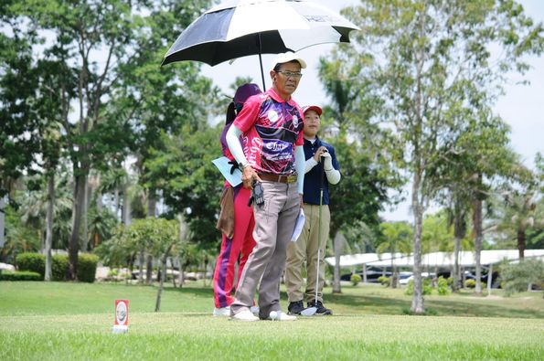 Lotus Valley Golf Resort 2 people people golfing golf cart golf course and text