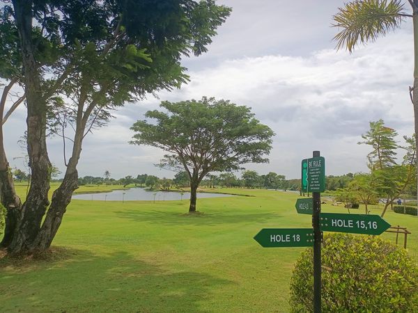 Bangpakong Riverside Country Club golf golf cart golf course tree grass and text