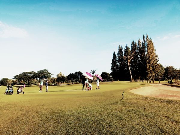Bangpakong Riverside Country Club 8 people people golfing and golf course