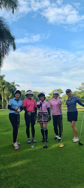 Krungthep Kreetha 5 people people golfing golf course and grass