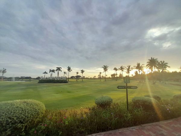 Bangpakong Riverside Country Club golf golf cart horizon grass twilight and golf course
