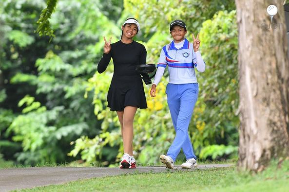Lotus Valley Golf Resort 2 people people golfing golf cart and golf course