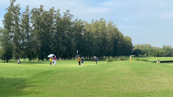 The Pine Golf Club 8 people people golfing golf course and grass