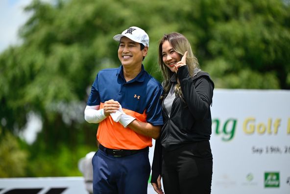 The RG City Golf Club or The Royal Gems Golf City 2 people people golfing golf course and text