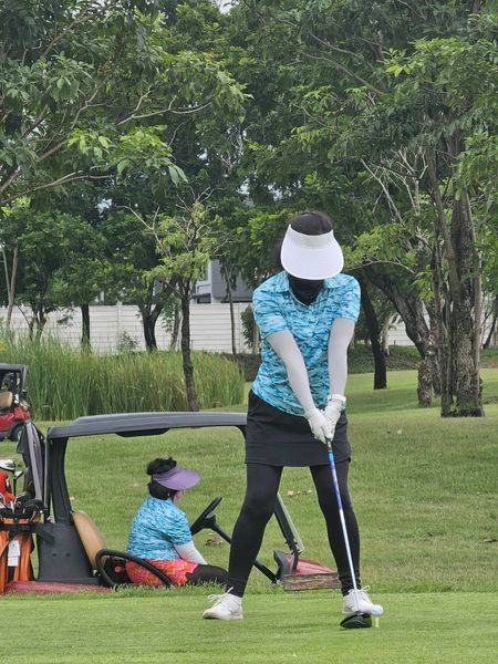 Muang Kaew Golf Course 2 people people golfing and golf course