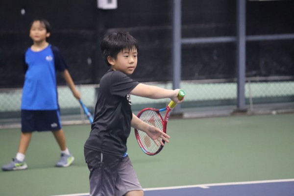 The Royal Bangkok Sports Club 2 people and people playing tennis