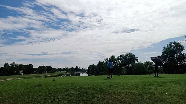 สนามกอล์ฟ 331 Golf Club 3 people people golfing frisbee tree grass golf course and cloud