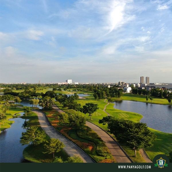 Panya Indra Golf Club twilight golf course grass lake and text