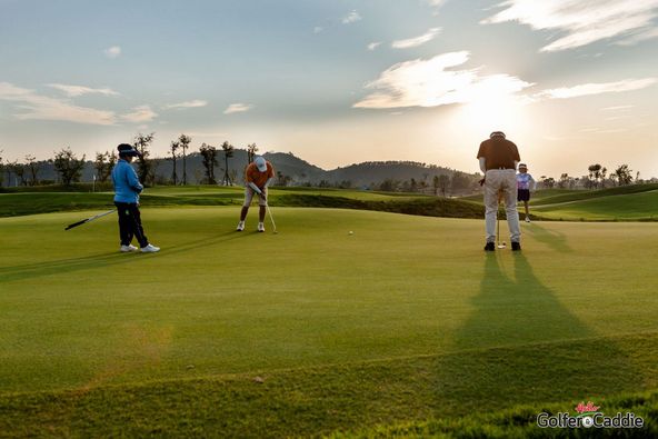 Alpinegolfresort Chiangmai 4 people people golfing golf cart and golf course