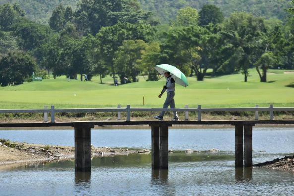 Alpinegolfresort Chiangmai 1 person golfing and golf course-5