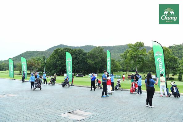 Alpinegolfresort Chiangmai 15 people people golfing golf cart golf course and text
