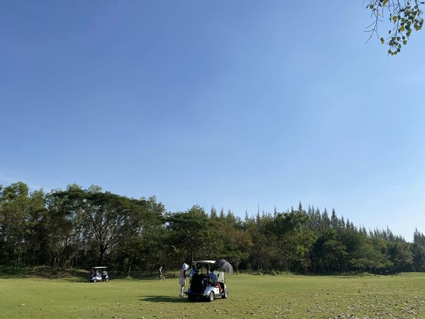 สนามกอล์ฟหริภุญชัย กอล์ฟคลับ 2 people people golfing golf cart grass and golf course