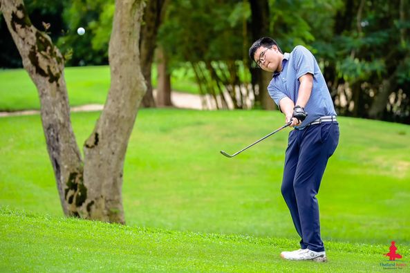 Alpinegolfresort Chiangmai 1 person golfing golf course and text-3