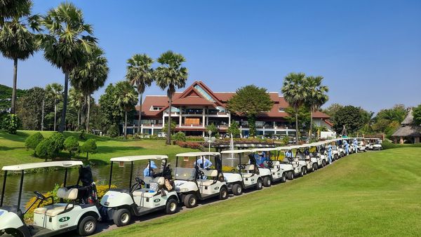 Summit Green Valley Chiangmai Country Club 2 people golf cart and grass